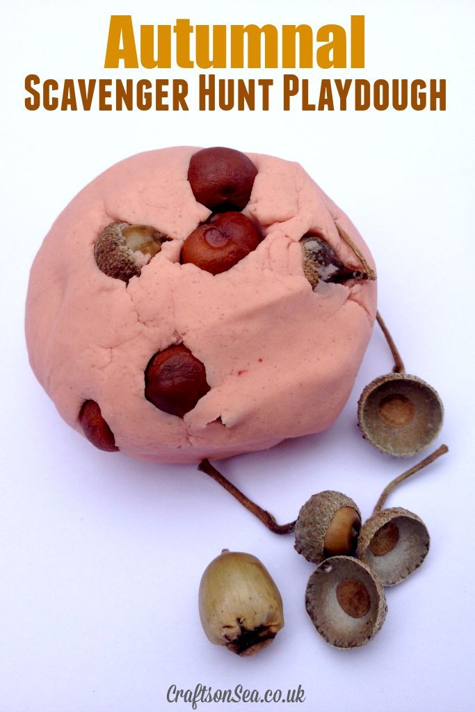 Scavenger Hunt Playdough with acorns in orange playdough