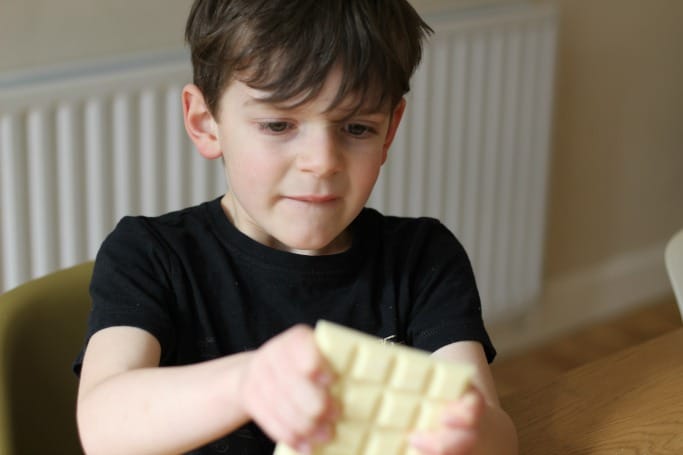 breaking chocolate for easter bark