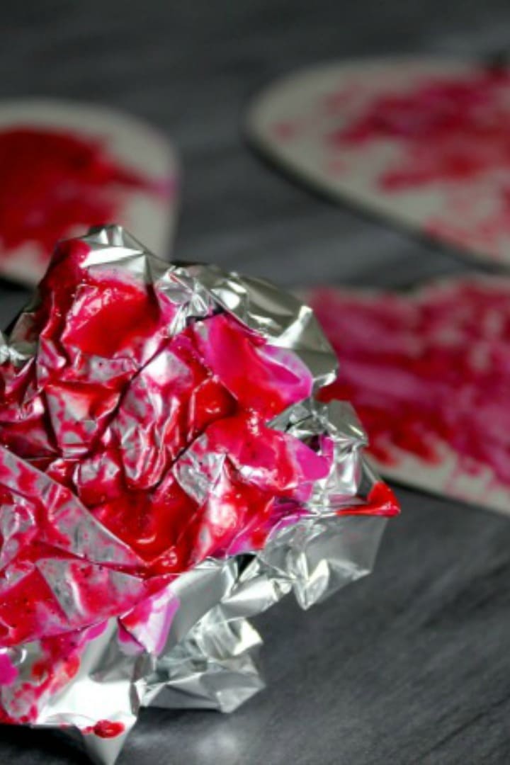 Foil Valentines Day Activity for Toddlers Preschoolers painting hearts