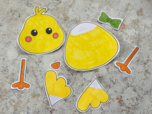 cut out the pieces for a build a chick cut and paste craft