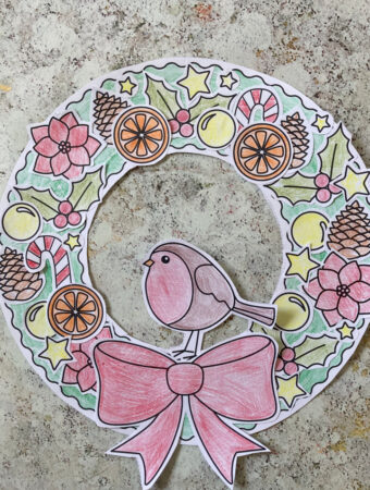 paper cut and paste Christmas wreath craft made using the free printable wreath template