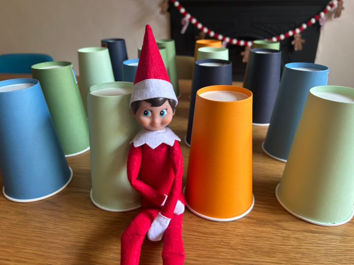 elf on the shelf leaving day game with treats under paper cups