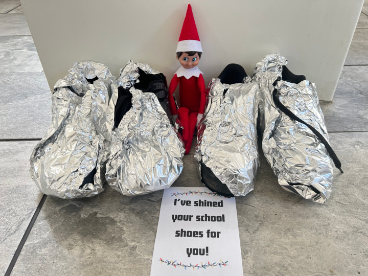 elf making school shoes shiny with foil