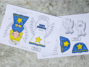 colored in printable angel Christmas card template using markers