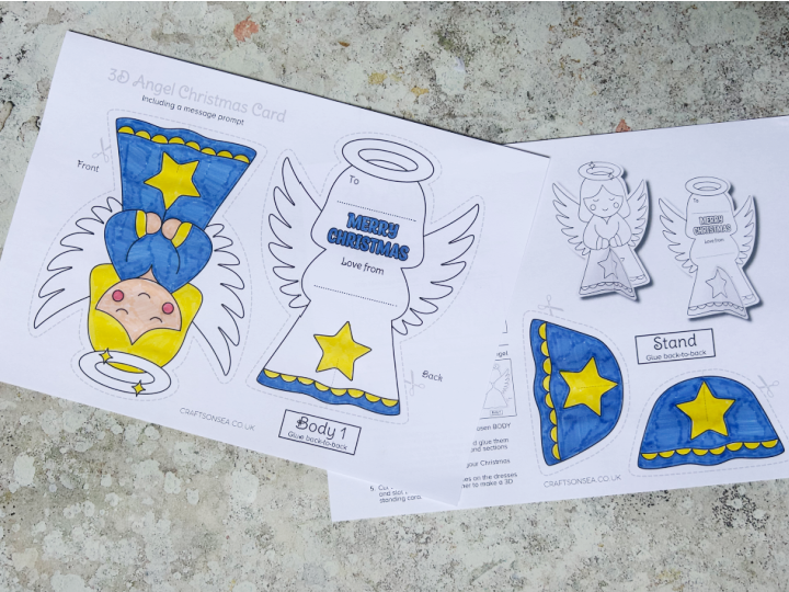 colored in printable angel Christmas card template using markers