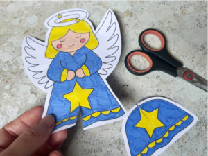 Making the cuts needed to assemble the printable 3D angel Christmas card craft