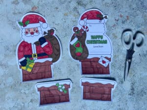 cut out pieces of the printable Santa card template