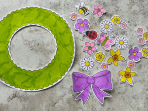 Cutting out the spring wreath craft template for kids