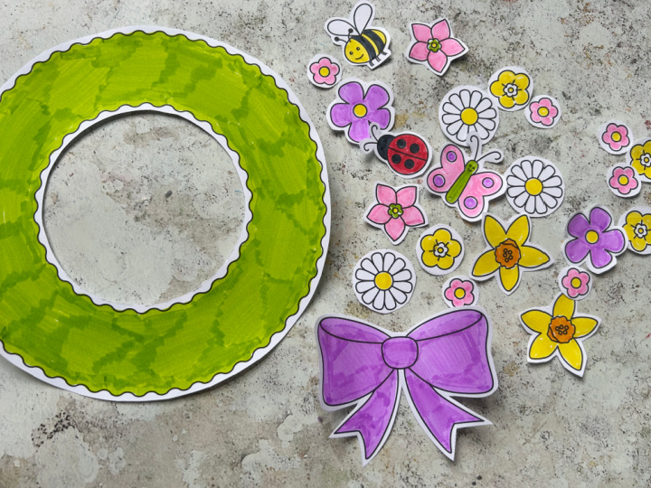 Cutting out the spring wreath craft template for kids