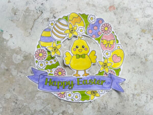 Close up of Easter wreath craft with chick eggs and flowers