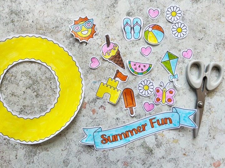 Cutting out the summer wreath craft template for kids
