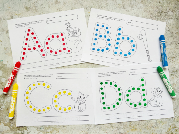 Landscape view of completed alphabet dot marker printables for letters A to D