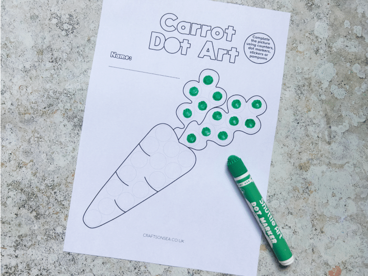 Carrot dot marker printable being decorated with dot markers