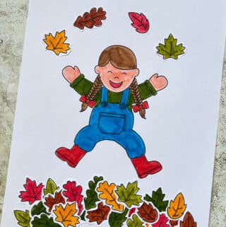 fall leaves cut and paste craft showing a child jumping in leaves