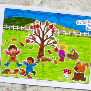 free printable fall scene craft for kids with tree, leaves and children playing