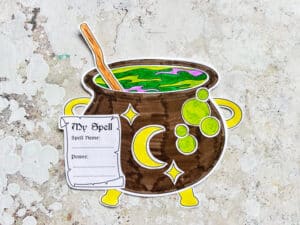 assembles cauldron craft with star and moon decorations and my spell sheet
