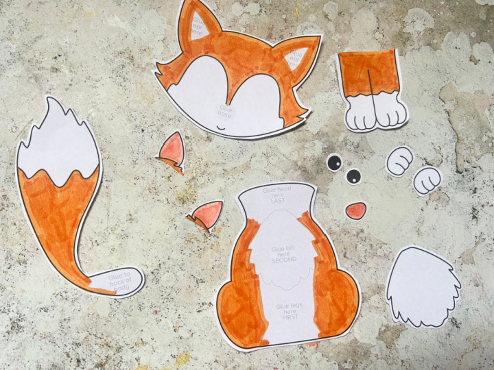 cutting out pieces for a fox craft