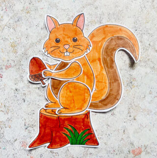 finished squirrel craft with an acorn and tree stump