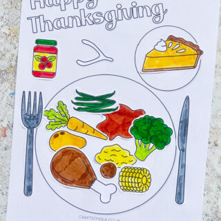 Thanksgiving dinner plate craft for kids with turkey, broccoli, cranberry sauce, sweet potato and pumpkin pie made with a free printable